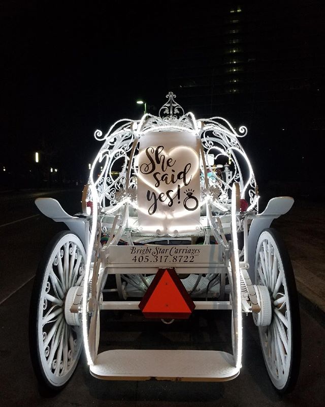 A carriage with the words " she said yes ".